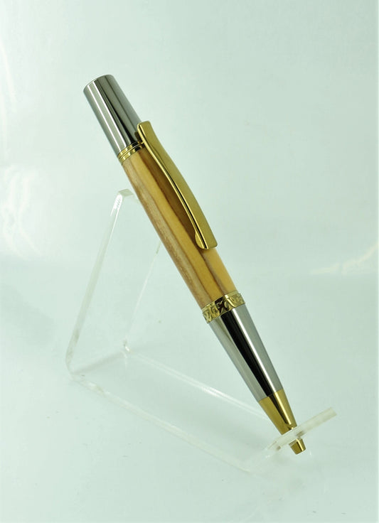 An olive wood hand made pen standing upright showing its gold plated nib, clip and center band patternation