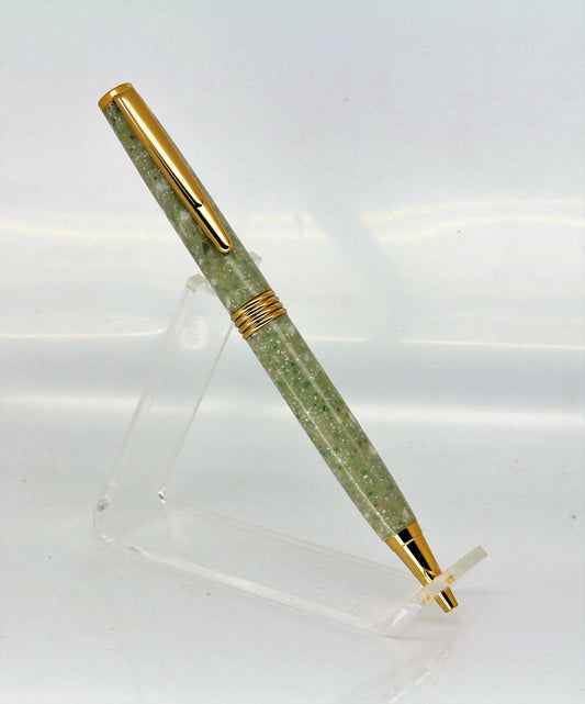 A pen standing upright and showing off the Light green Corian and mottled colours and effects to the full, complete with Chrome plated fitting to show the effect off.