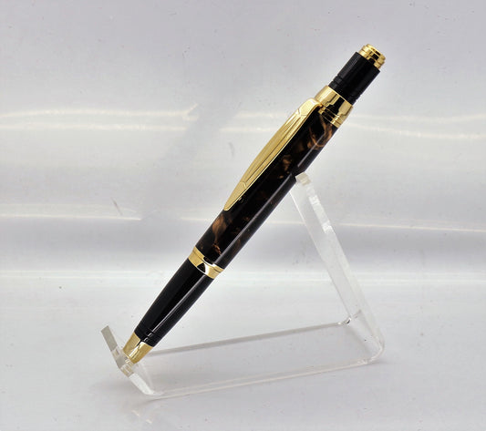 pen standing upright on an clear acrylic stand, showing off it's antique brown and acetate designs and effects to the full, complete with Gold plated fitting to show the effect off.